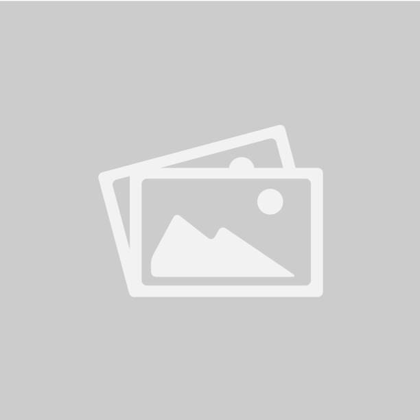 A scenic meadow with a river, trees, and a picturesque sky at sunset.